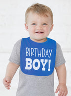 Detailed view of white screen-printed lettering on Aiden's Corner birthday bib