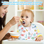 Baby wearing white HooLing feeder drool bib