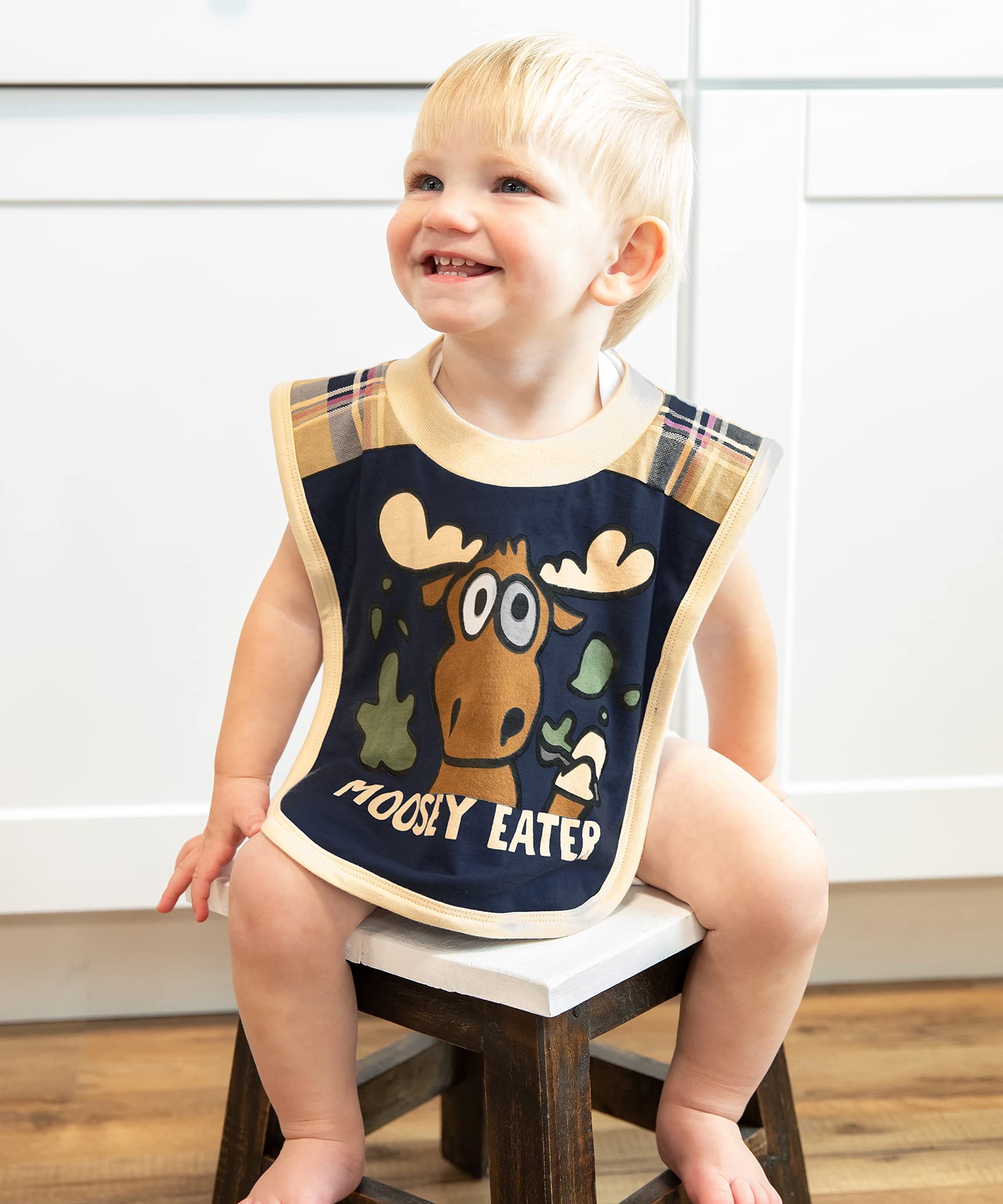 Rear view of Lazy One animal print infant bib with elastic neck