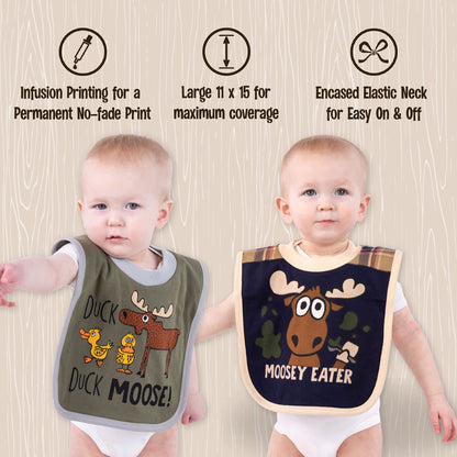 Infant wearing Lazy One animal print bib during meal time