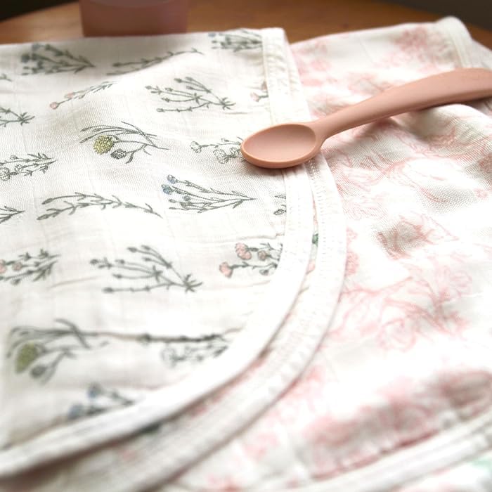 Detail of snap closure on Aden + Anais baby bib