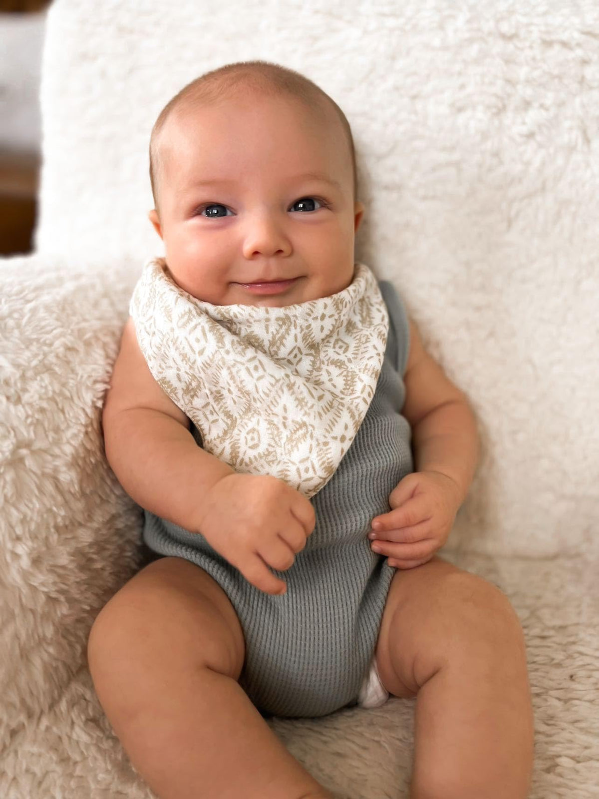 Crane Baby bib showing adjustable snap button closure detail