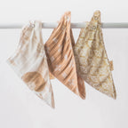 Three piece muslin bib set for babies in neutral colors