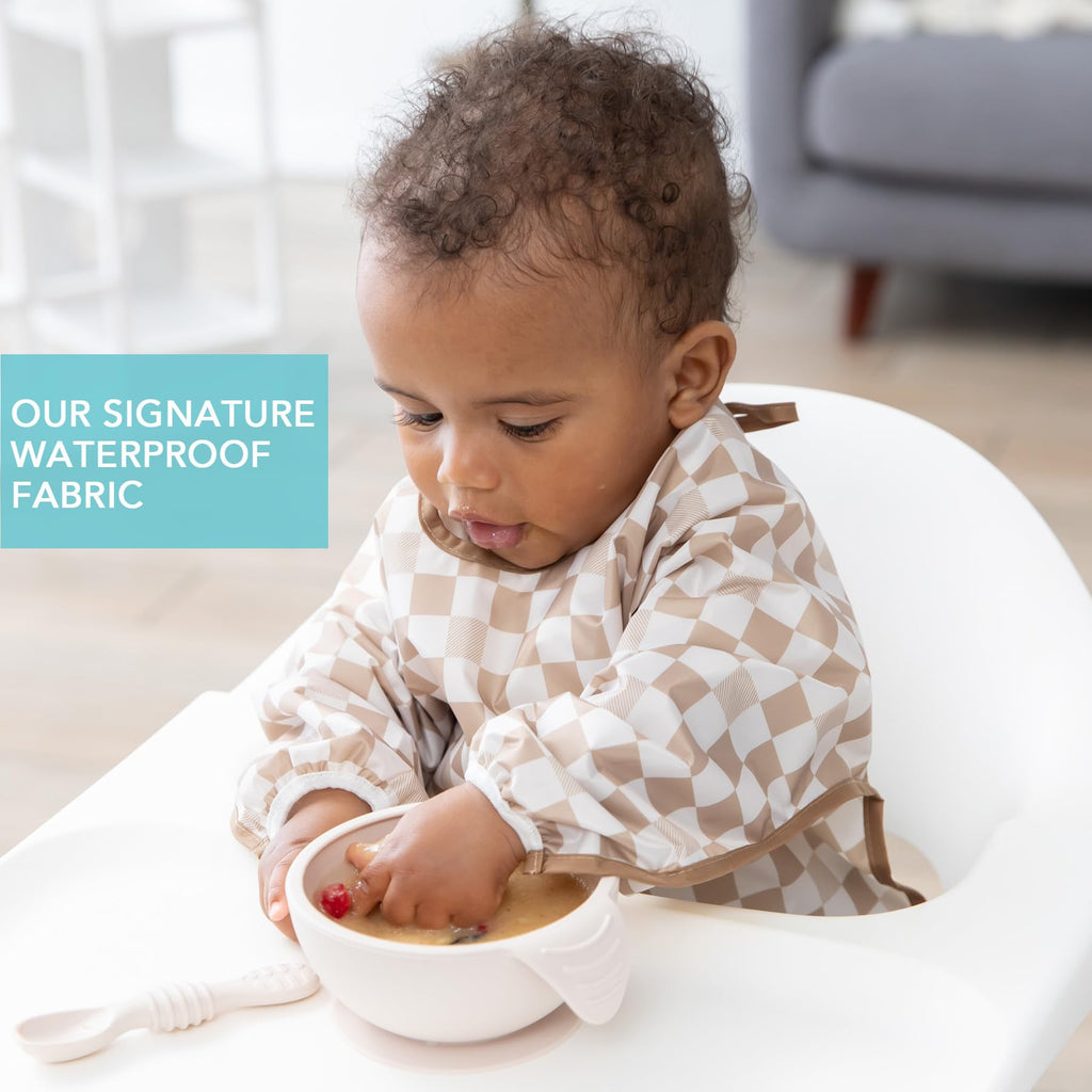 Bumkins feeding bib showing elastic cuffs and food catcher
