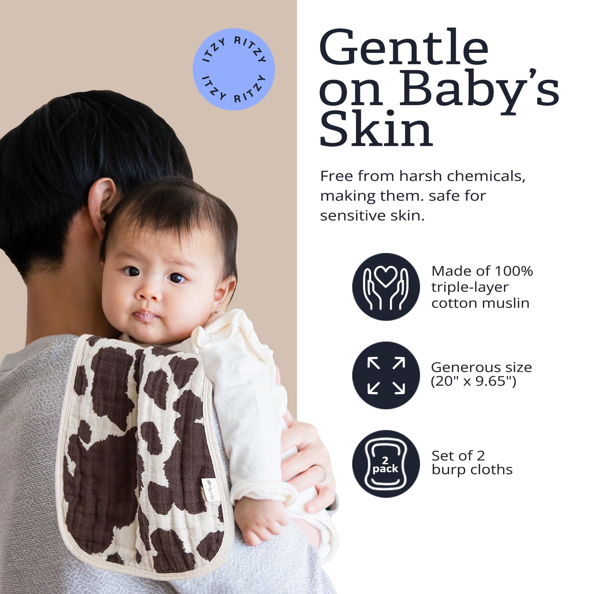 Parent using Itzy Ritzy cow print burp cloth over shoulder