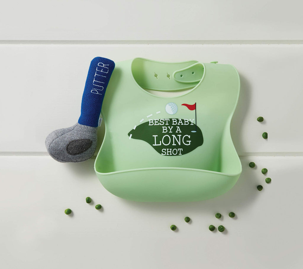 Mud Pie green silicone baby bib featuring crumb catcher next to a sweater knit golf putter rattle toy