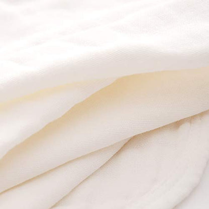 Stack of five white Mukin muslin newborn burp cloths
