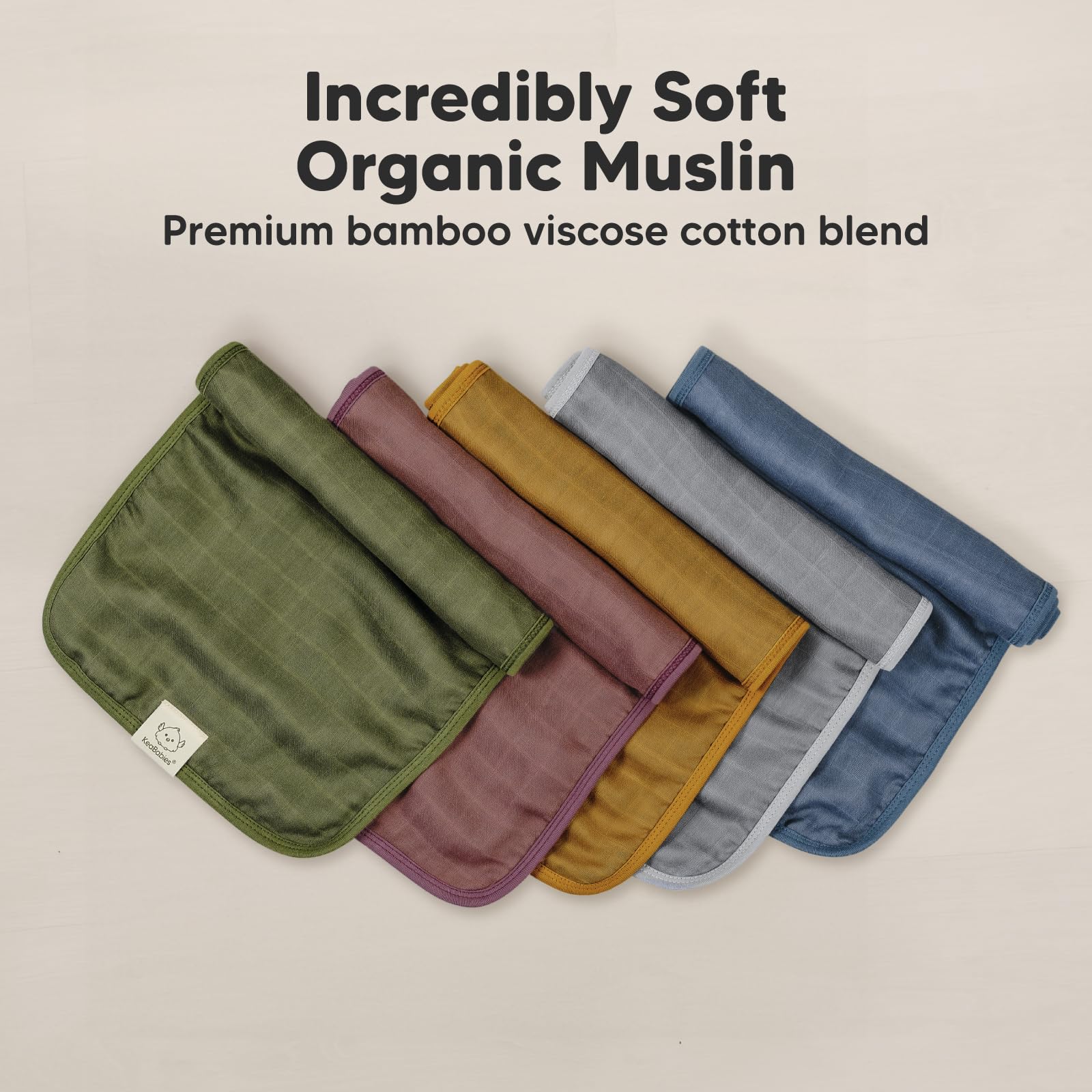 KeaBabies muslin burp cloths draped over shoulder
