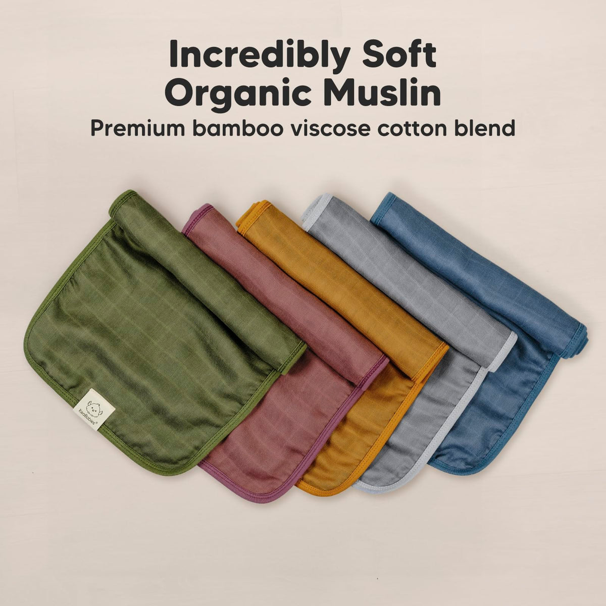 KeaBabies muslin burp cloths draped over shoulder