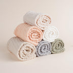 Soft absorbent muslin burp cloth being used as a washcloth