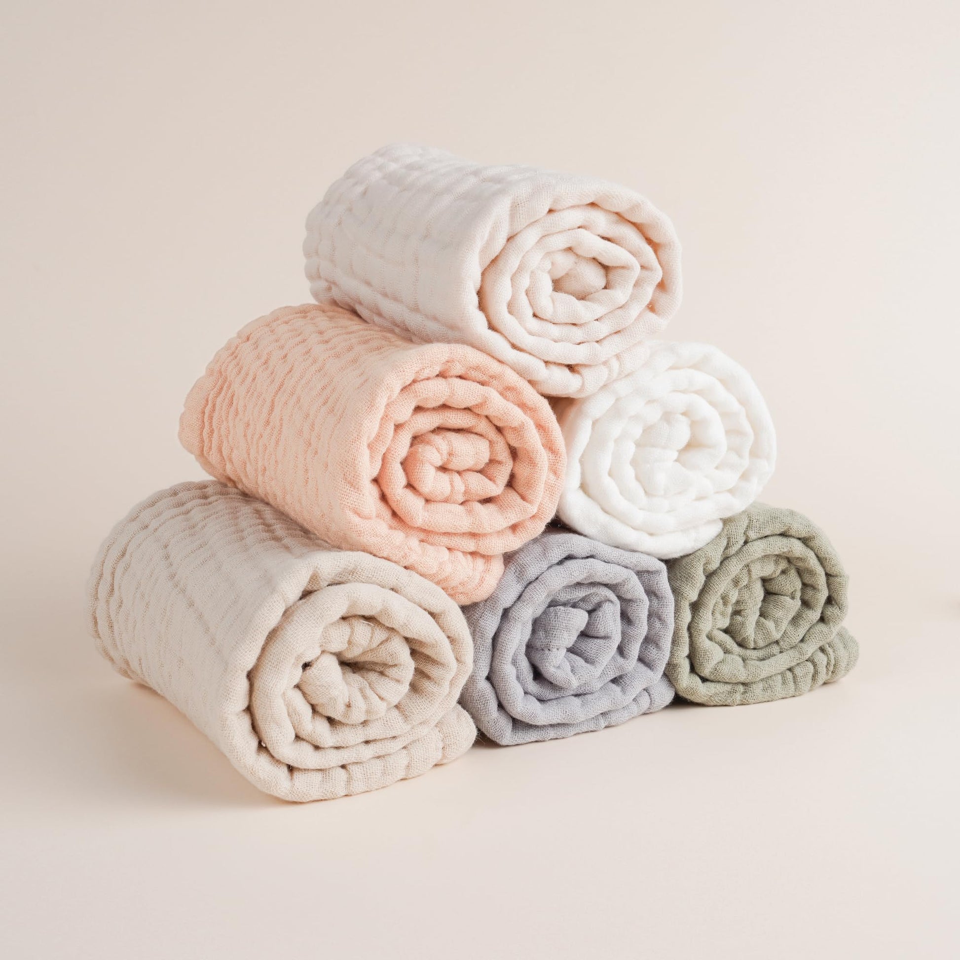 Soft absorbent muslin burp cloth being used as a washcloth