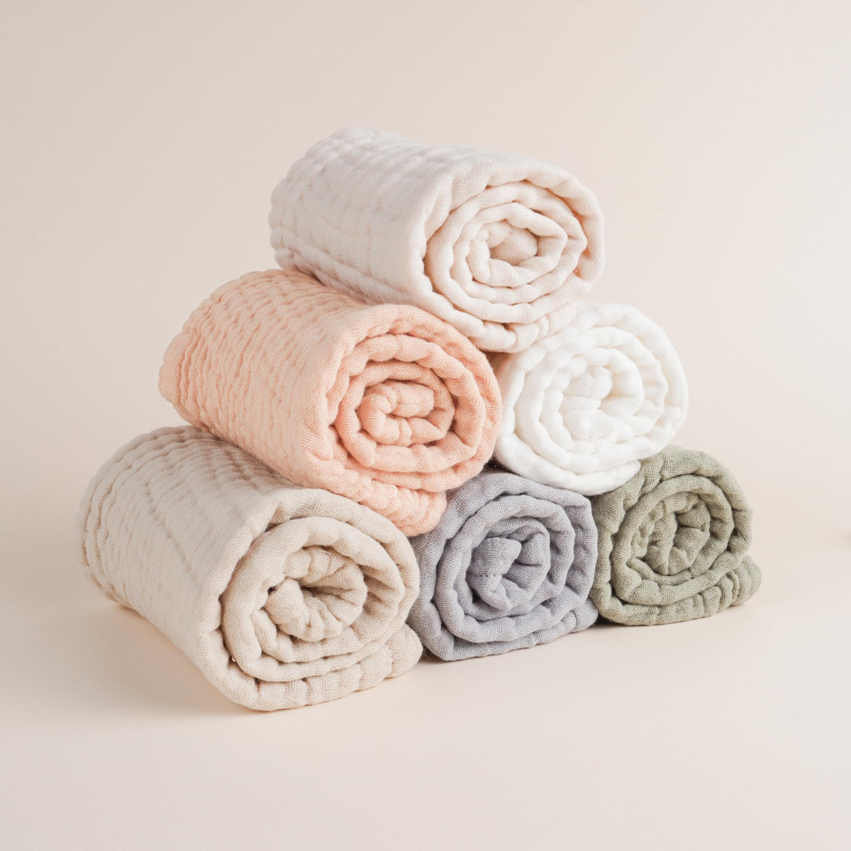 Soft absorbent muslin burp cloth being used as a washcloth