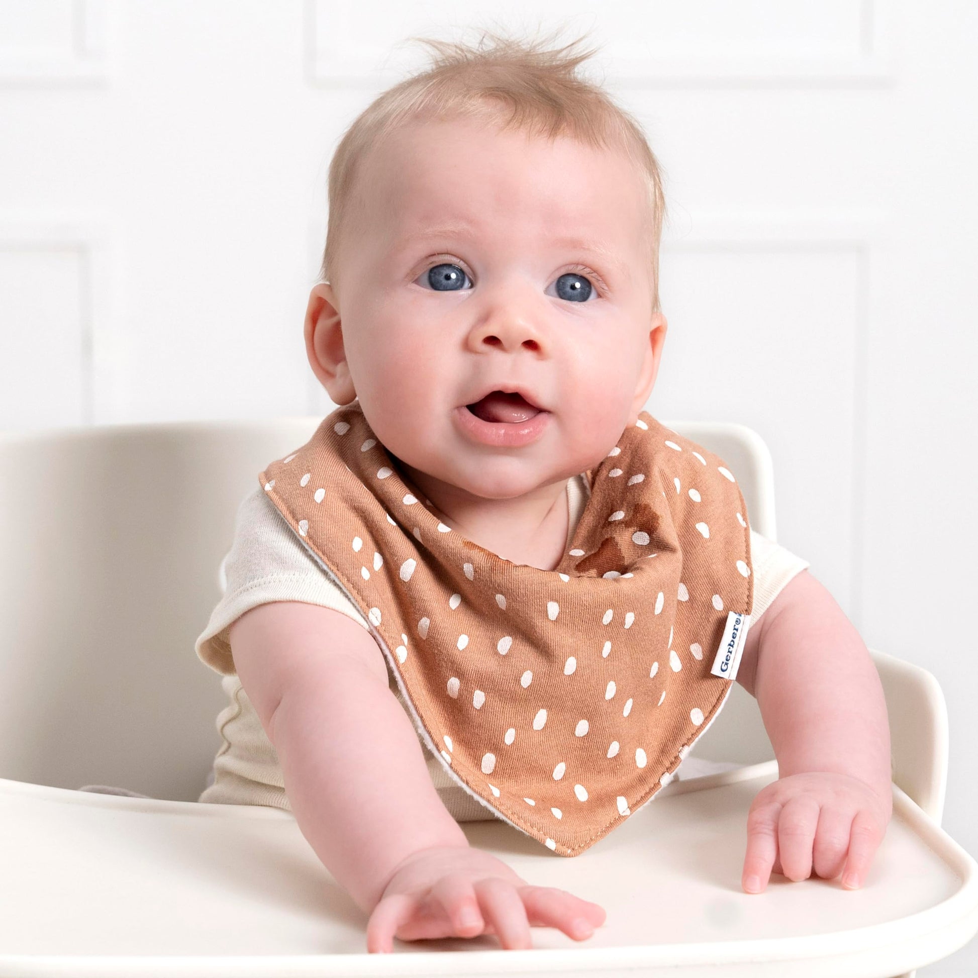 Stack of 10 Gerber neutral pattern bandana bibs for infants
