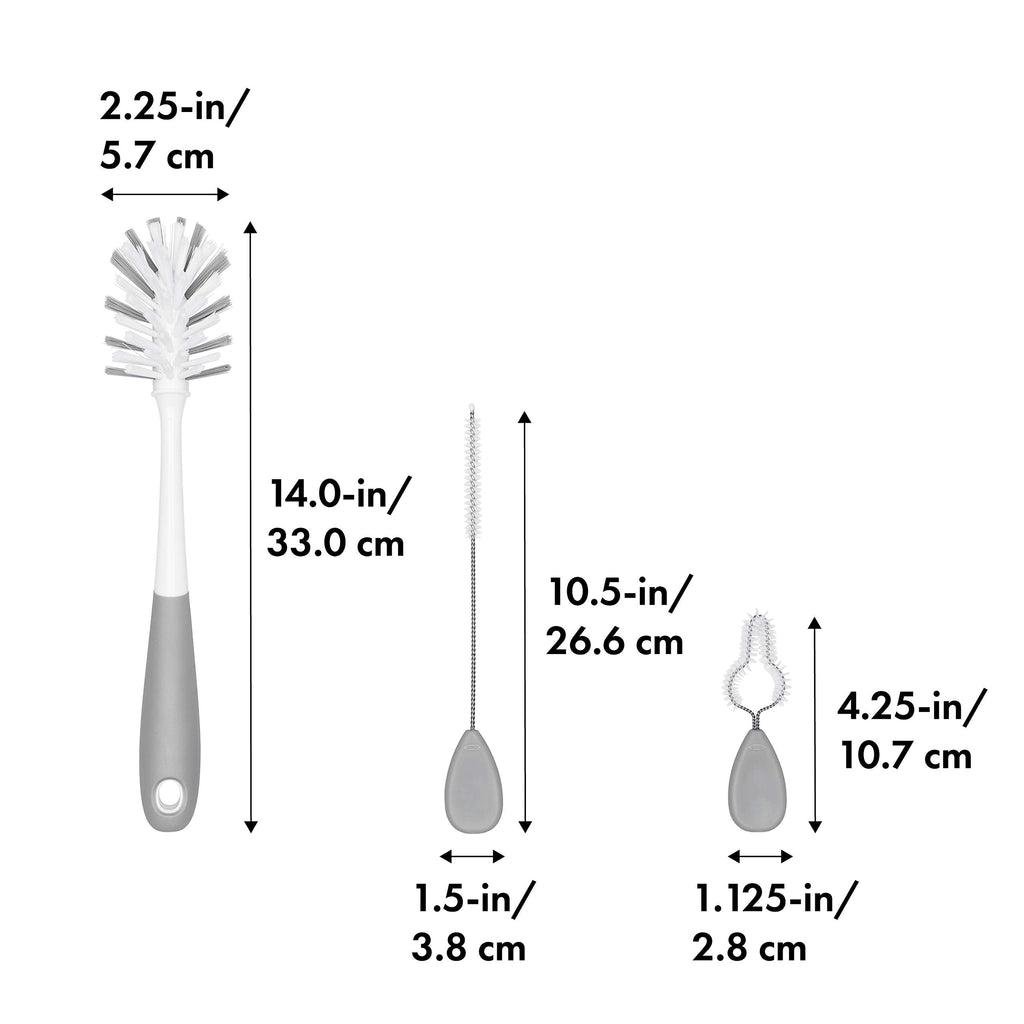 OXO Tot cleaning brushes arranged in gray storage stand
