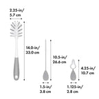 OXO Tot cleaning brushes arranged in gray storage stand