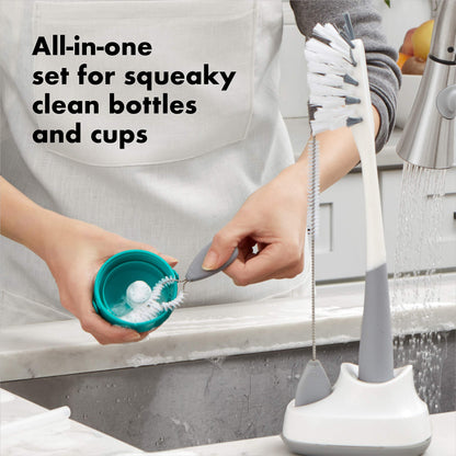 Close up of OXO Tot straw brush cleaning a sippy cup