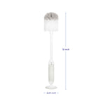Ubbi bottle brush with suction cup base standing on counter