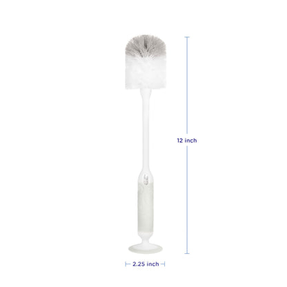 Ubbi bottle brush with suction cup base standing on counter