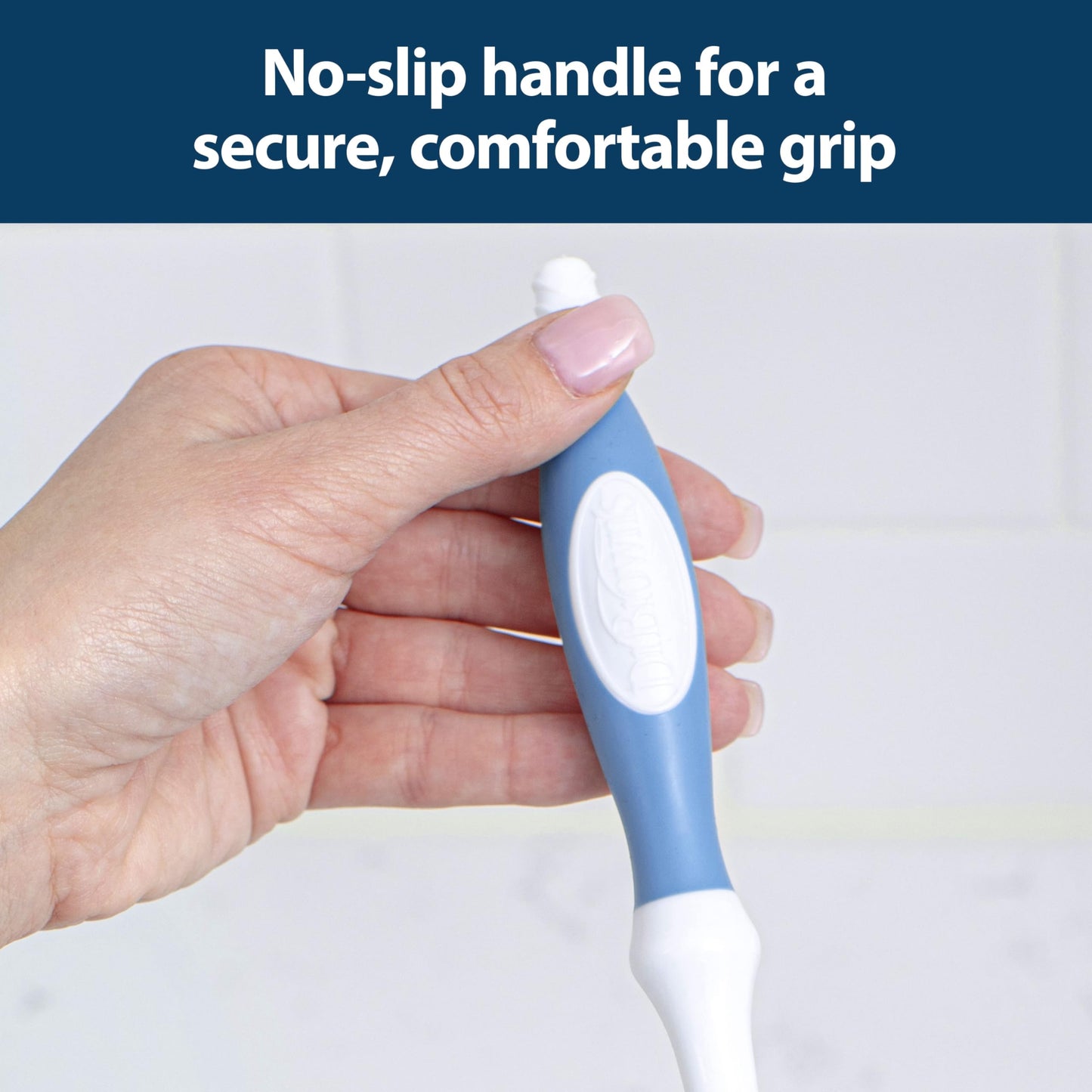 Detailed view of the integrated nipple cleaner on the brush handle