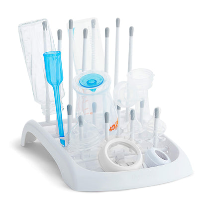 Munchkin drying rack holding baby bottles on a countertop