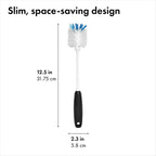 OXO kitchen brush resting on a drying mat