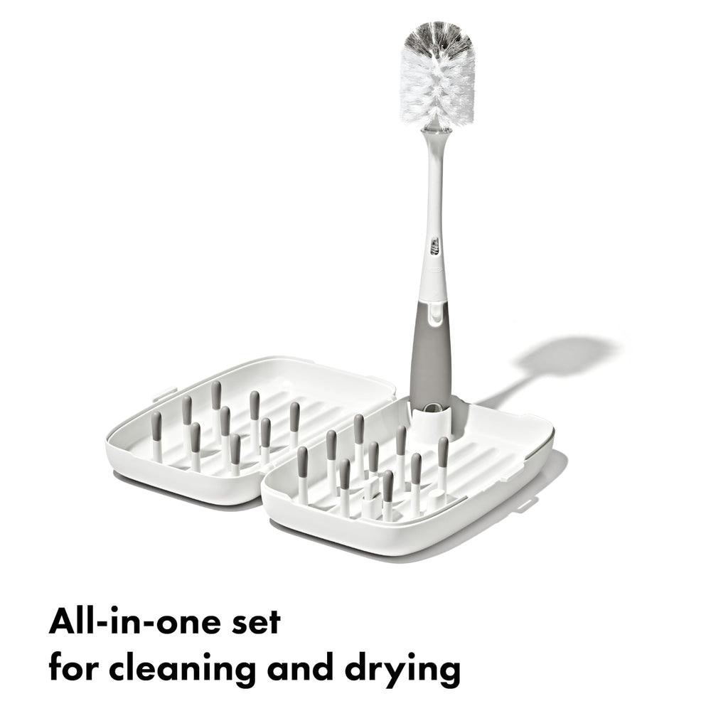 OXO Tot travel drying rack folded and compact in hand
