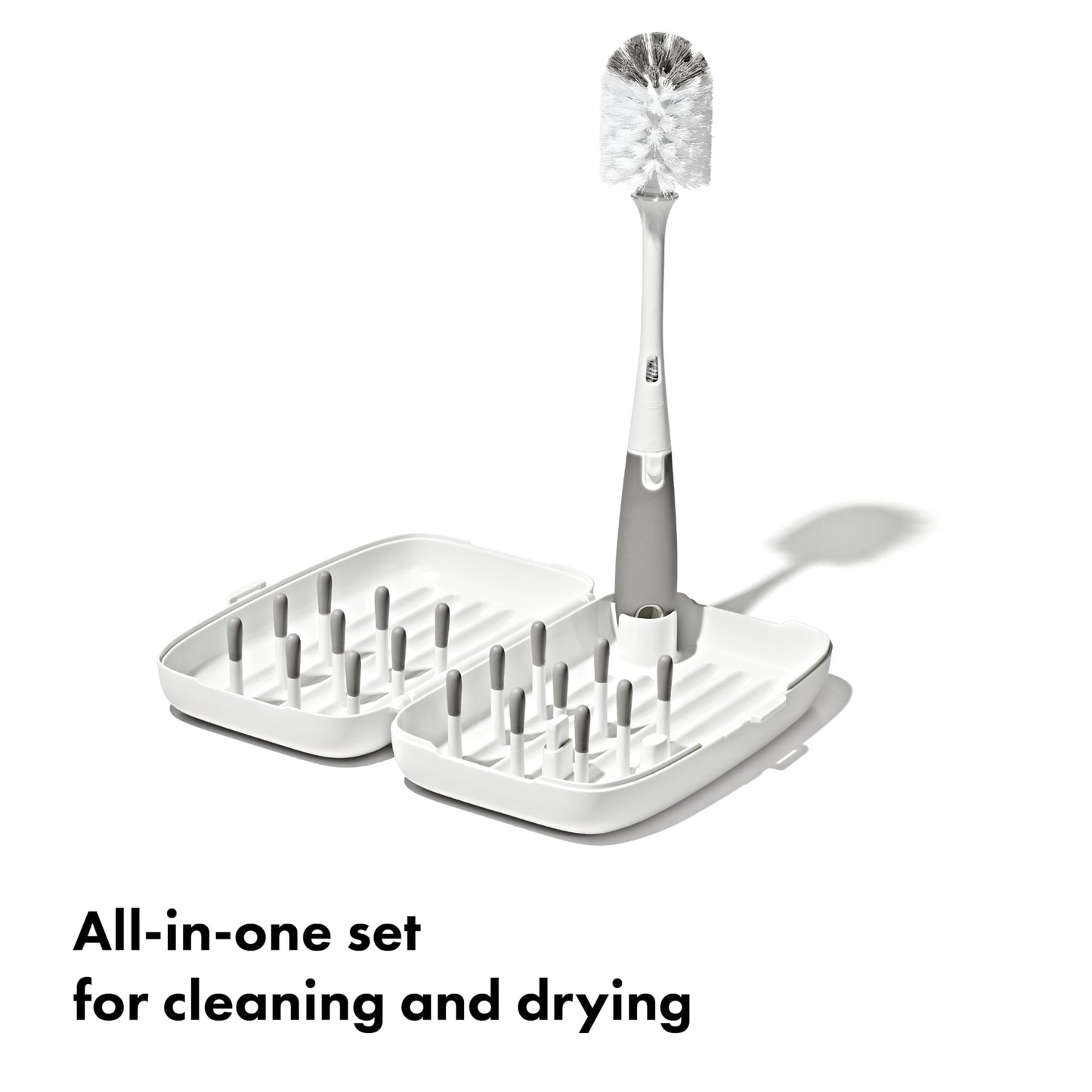 OXO Tot travel drying rack folded and compact in hand