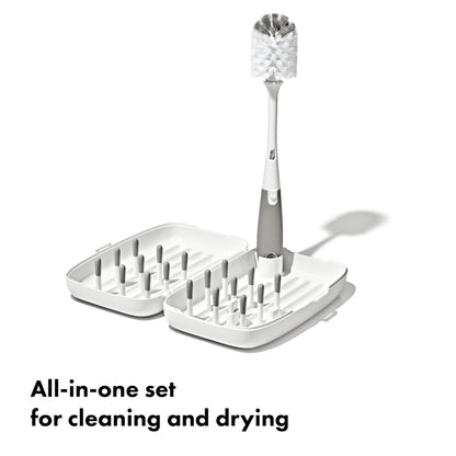 OXO Tot travel drying rack folded and compact in hand