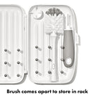 OXO Tot drying rack opened with baby bottles on pegs