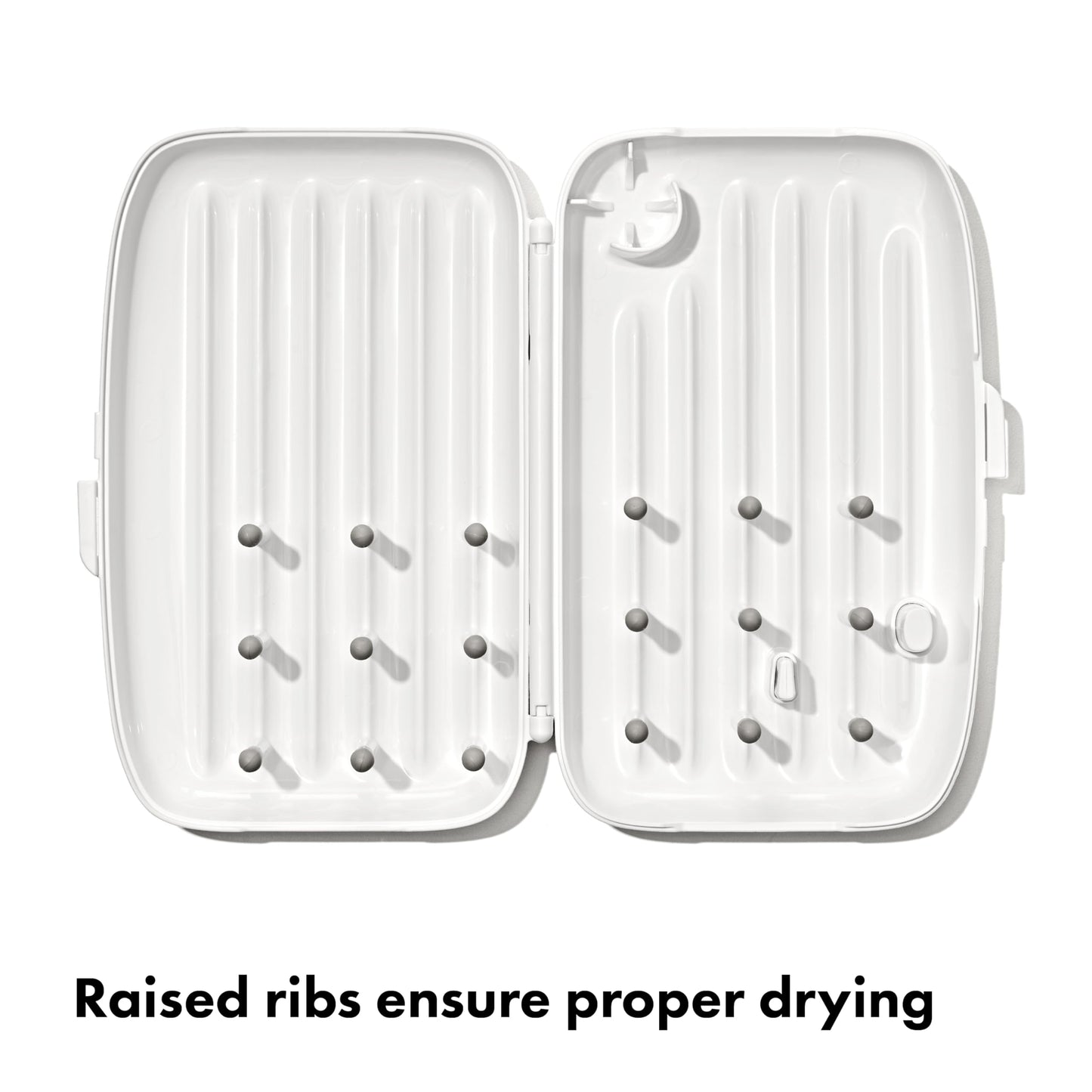 Side view of OXO Tot portable drying rack with ventilation holes