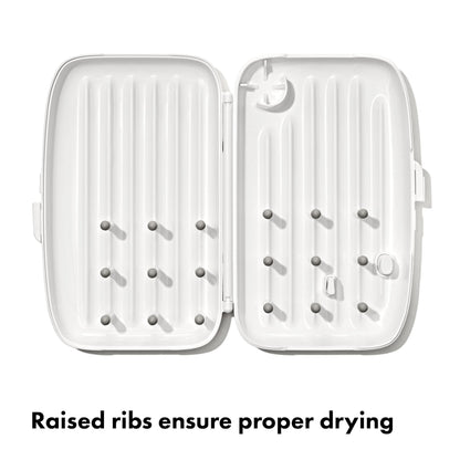 Side view of OXO Tot portable drying rack with ventilation holes