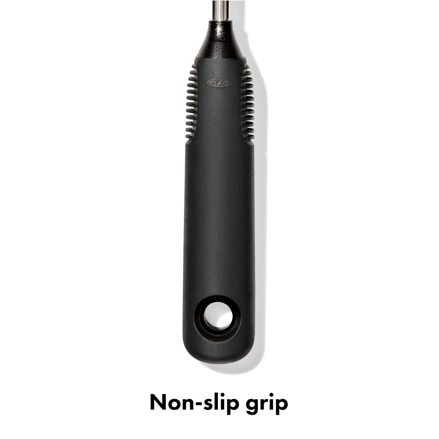 Hand holding OXO bottle brush with non-slip handle