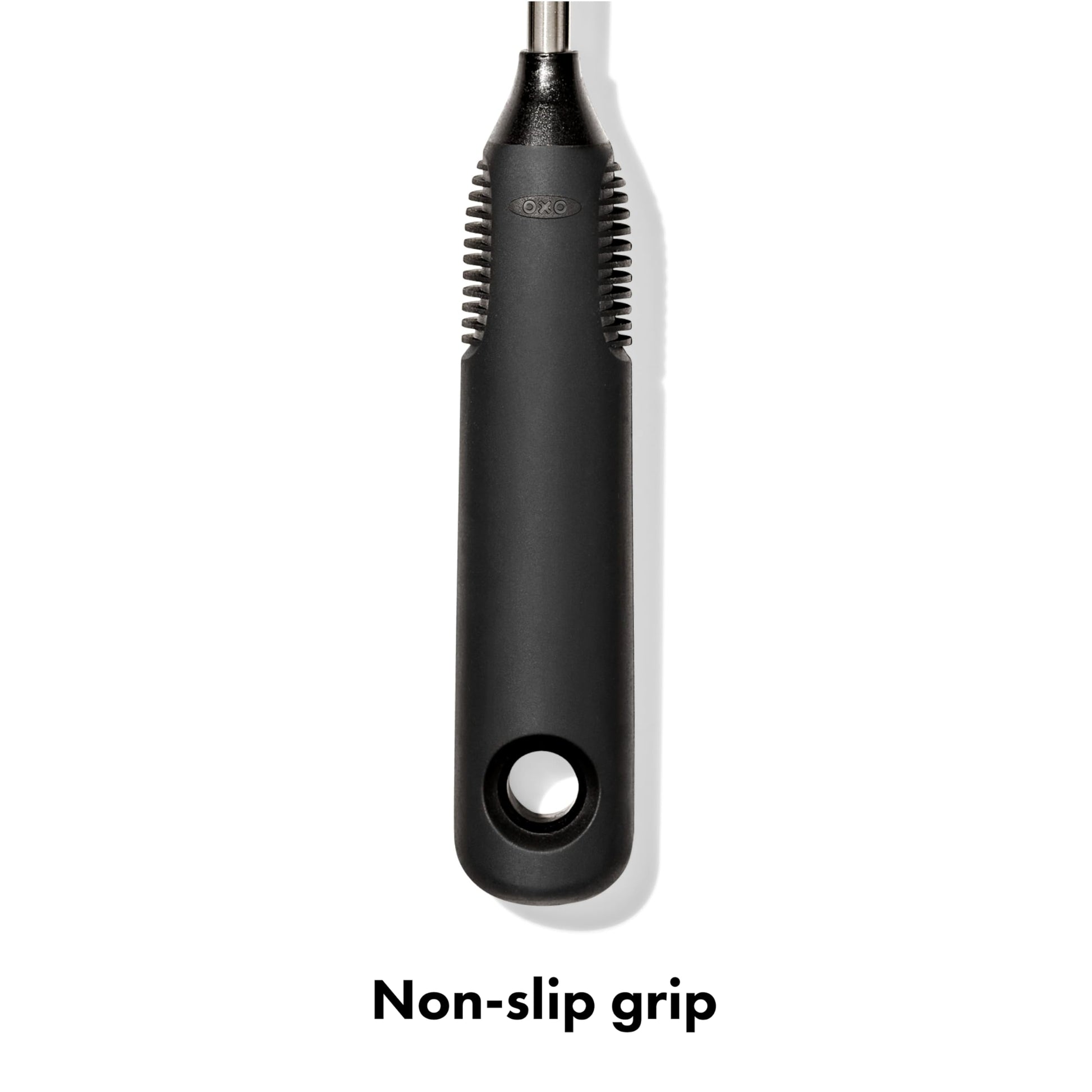 Hand holding OXO bottle brush with non-slip handle
