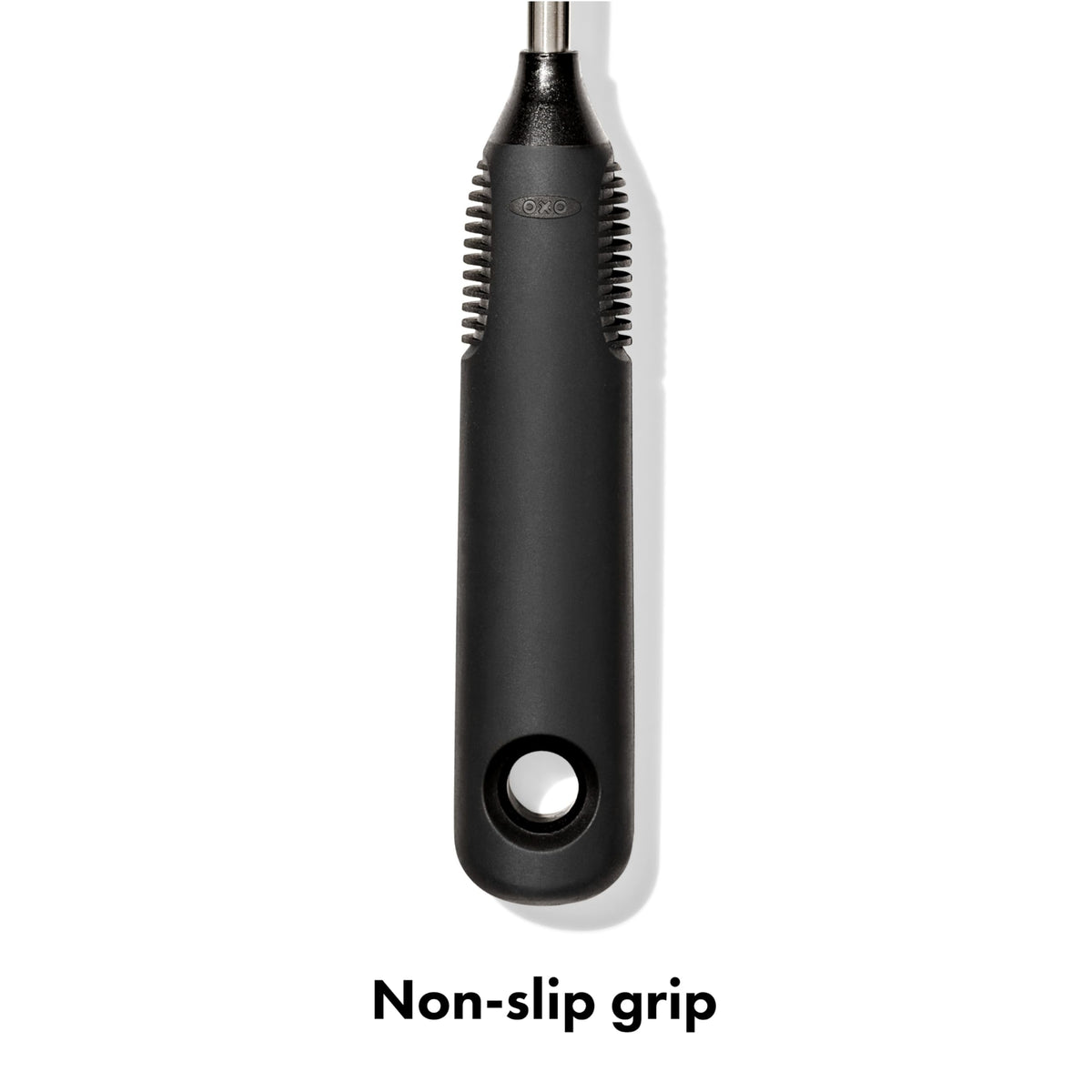 Hand holding OXO bottle brush with non-slip handle