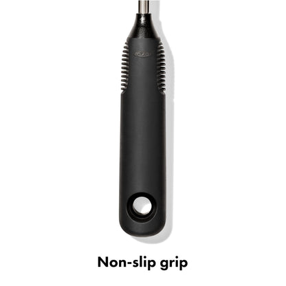 Hand holding OXO bottle brush with non-slip handle