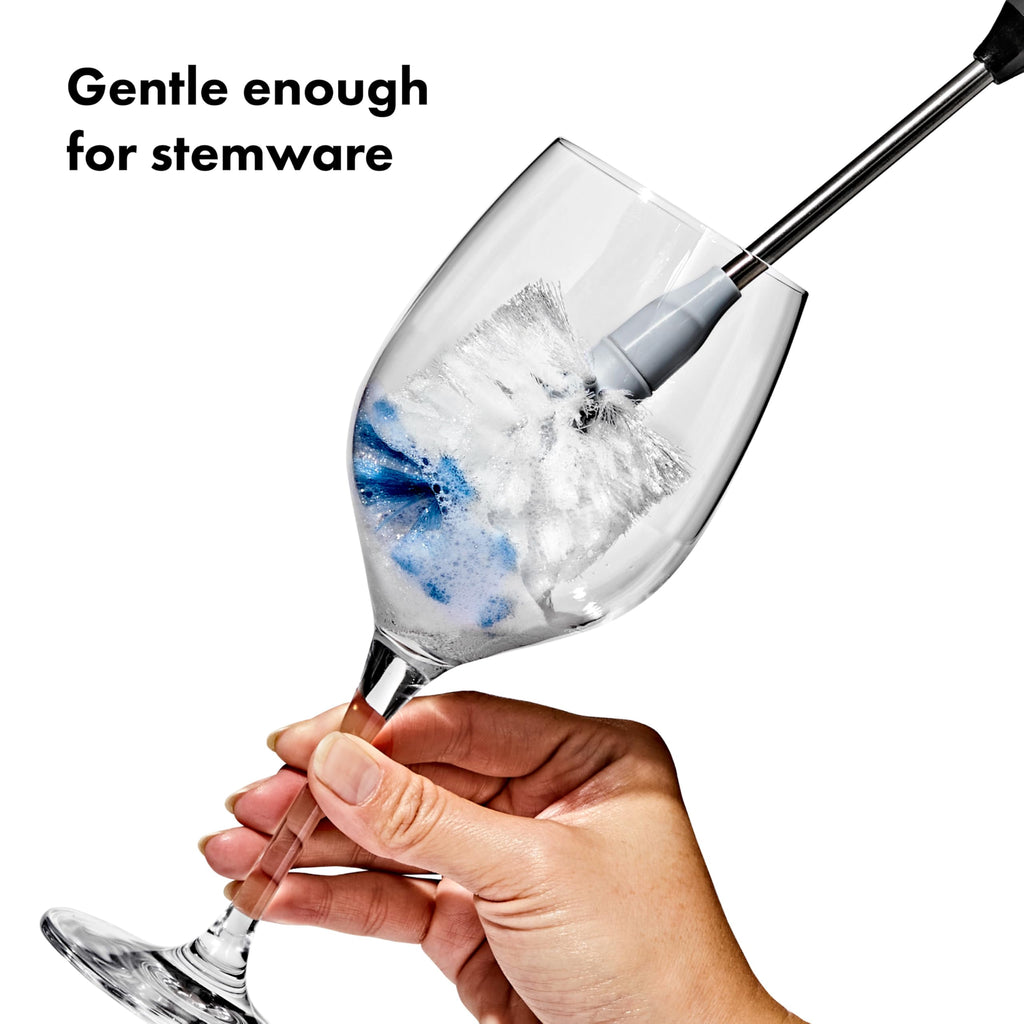 OXO bottle brush cleaning a glass water bottle