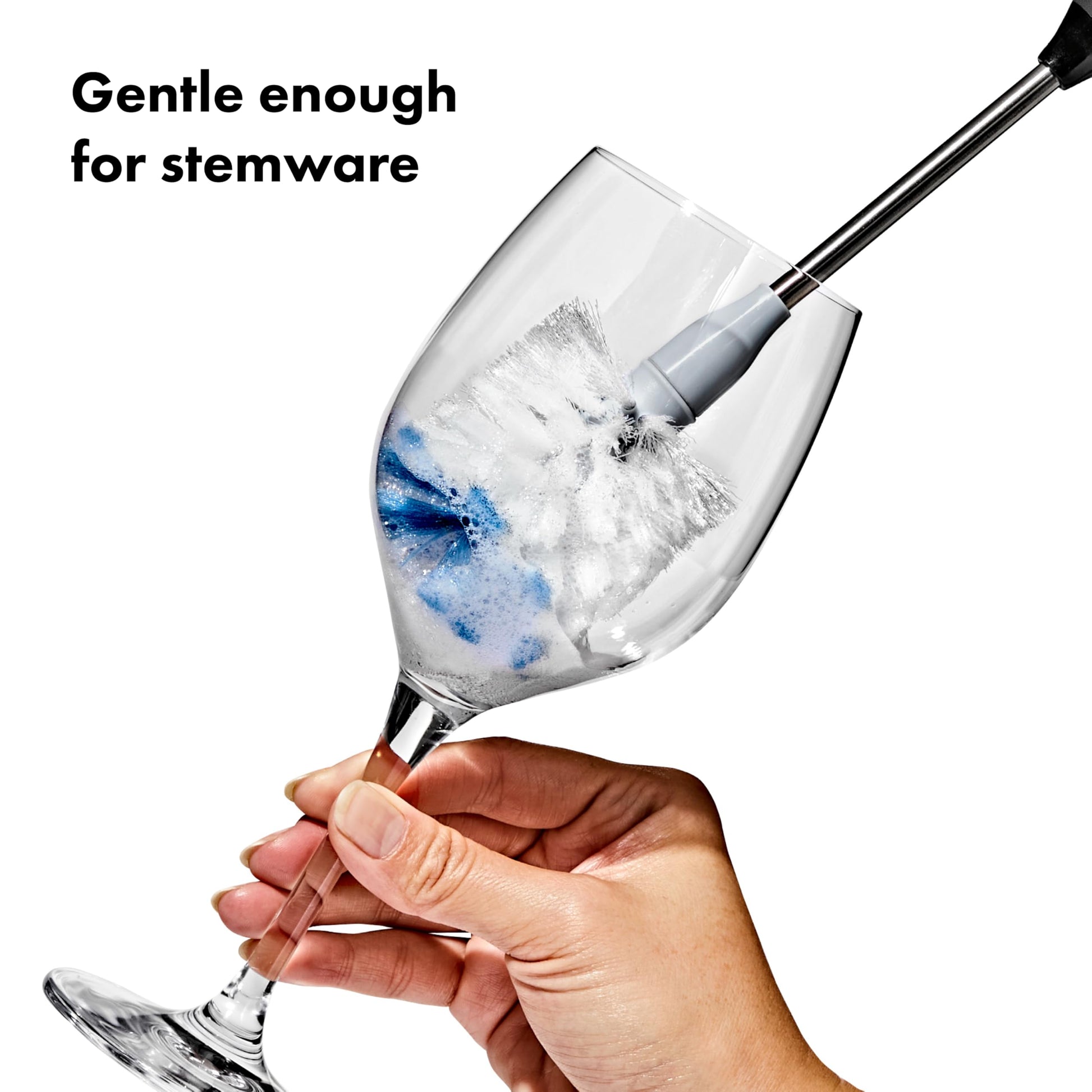 OXO bottle brush cleaning a glass water bottle