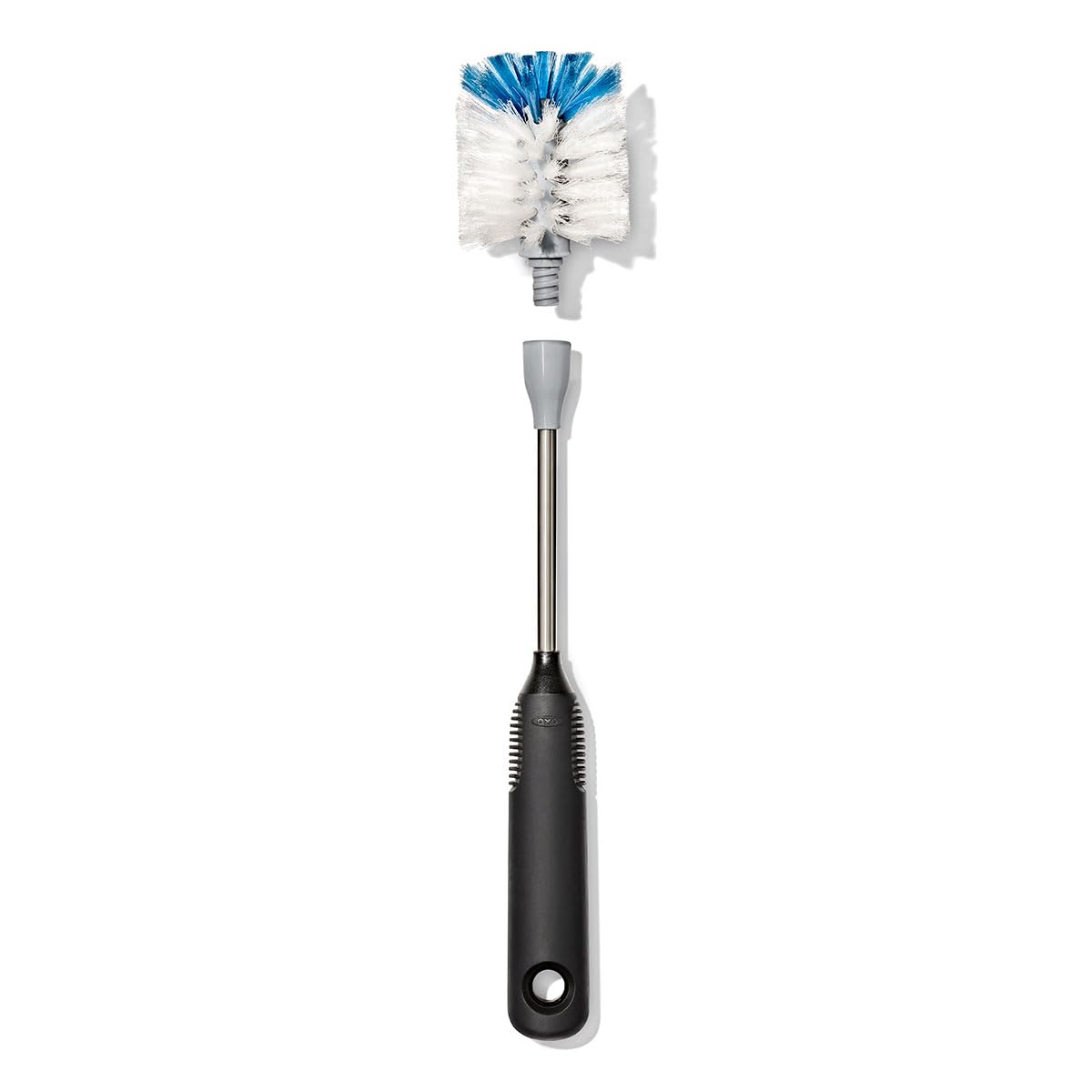OXO bottle brush cleaning a crystal wine glass