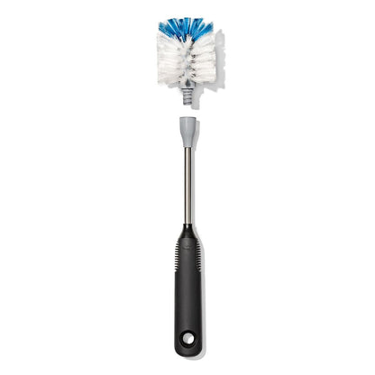 OXO bottle brush cleaning a crystal wine glass
