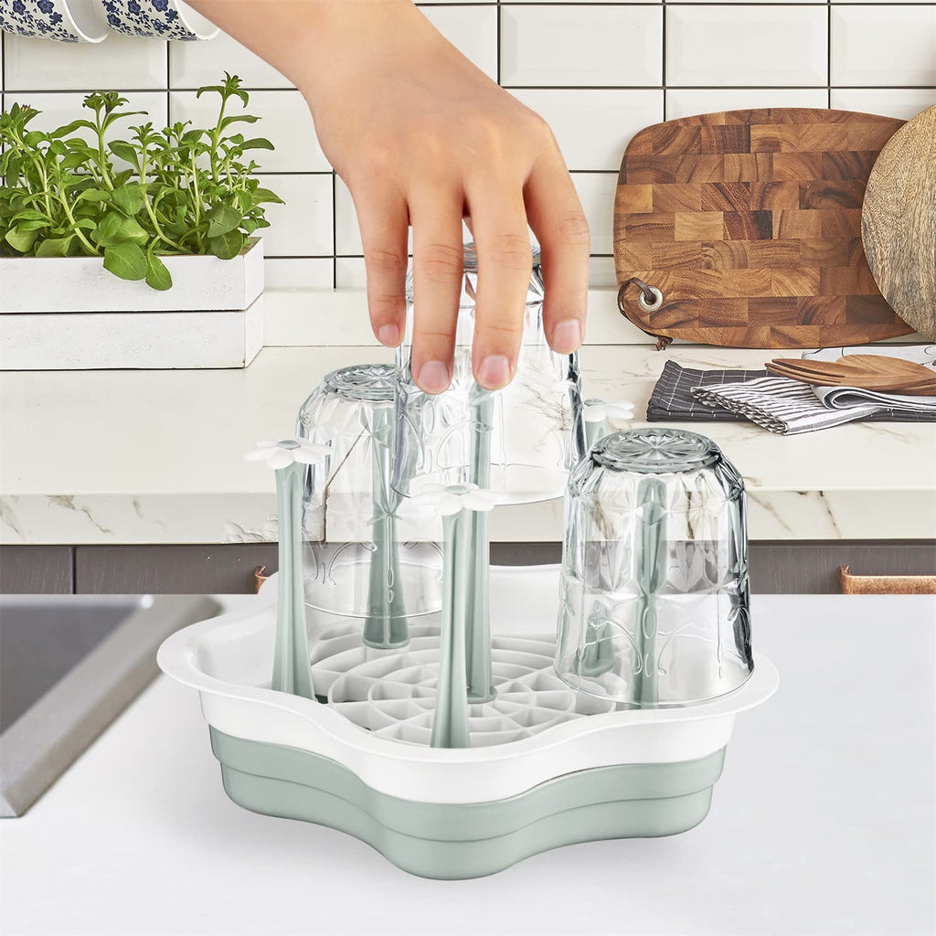 L-Wash drying rack holding various baby bottles and tumblers