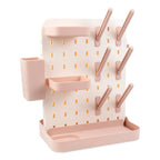 Close up of customizable pegs on baby bottle drying rack
