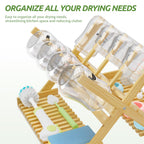 Vertical bamboo rack holding multiple baby bottles