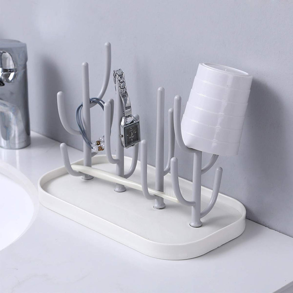 Green cactus shaped bottle rack with drain tray on kitchen counter