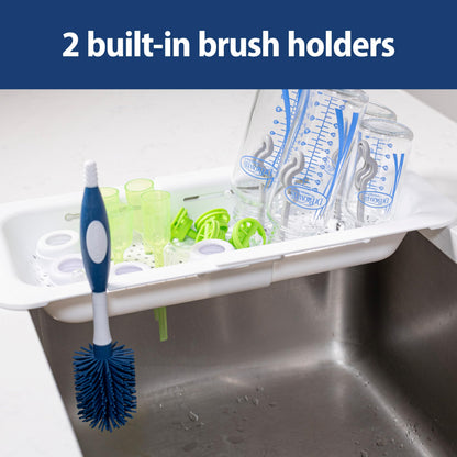Close up of sink caddy drying baby bottle parts