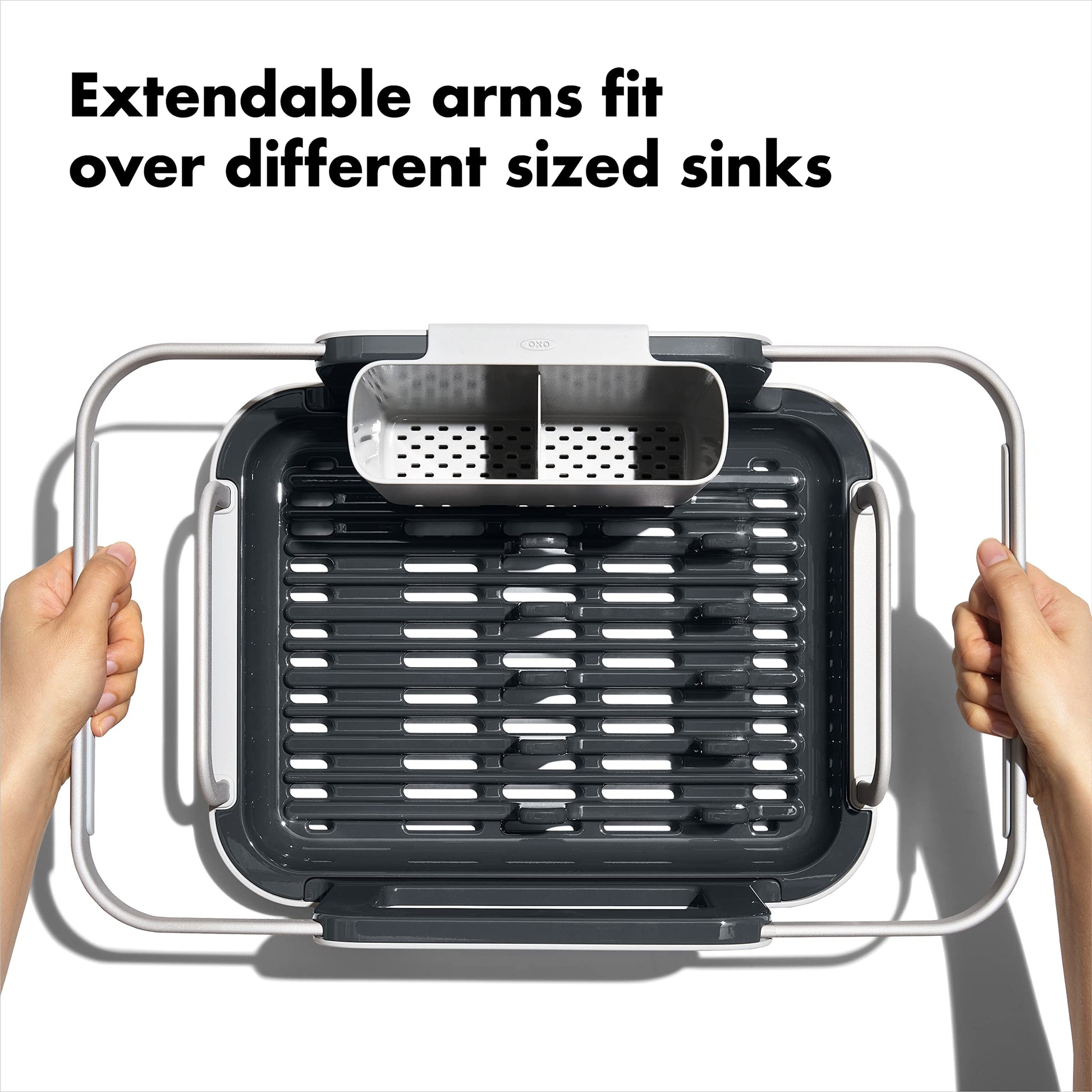 OXO dish rack extended over kitchen sink for drying