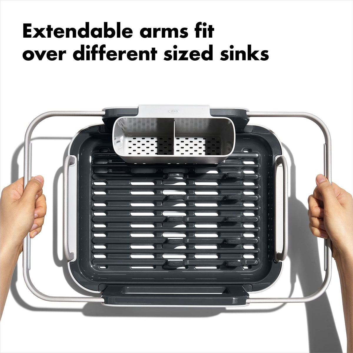 OXO dish rack extended over kitchen sink for drying