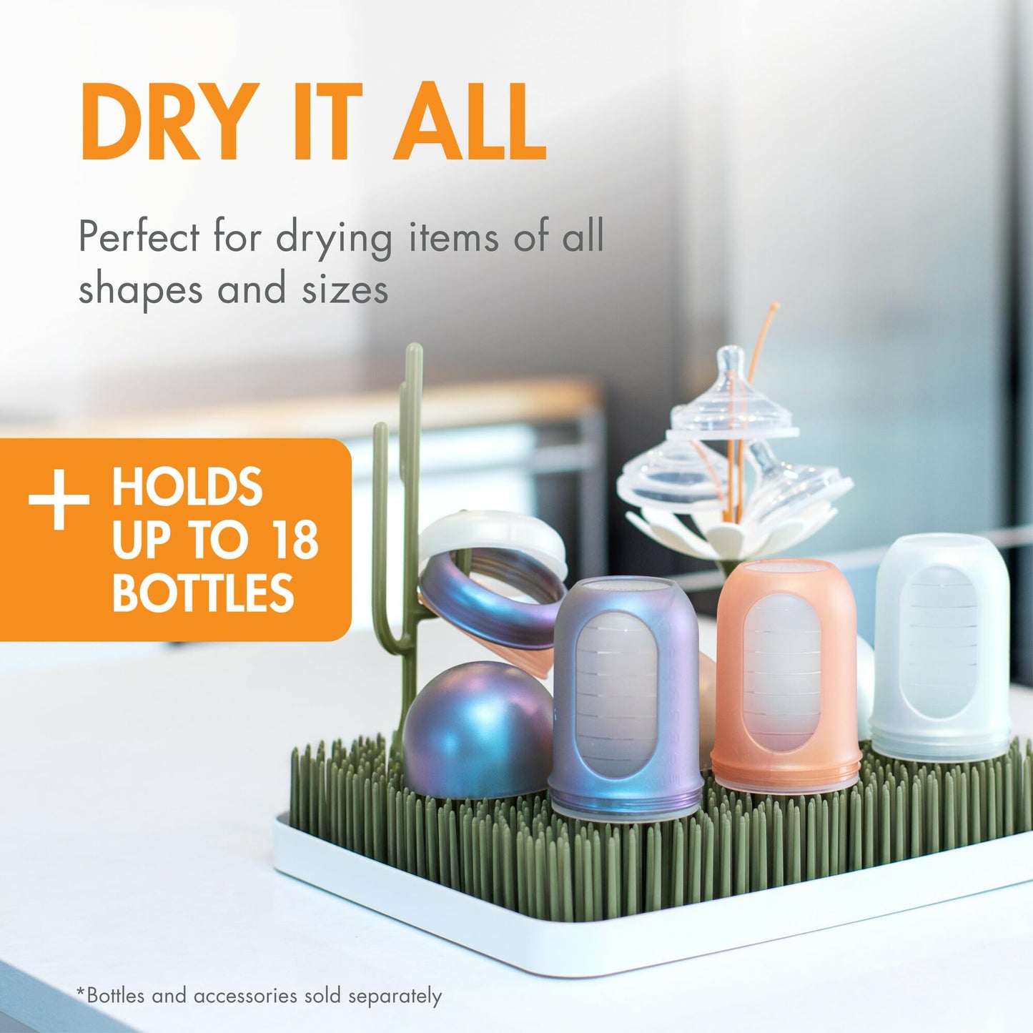 Boon Lawn baby bottle drying rack with bottles and accessories