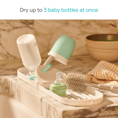 Munchkin baby bottle rack holding three bottles