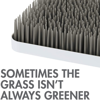 Close up of Boon Grass flexible green blades for drying baby accessories