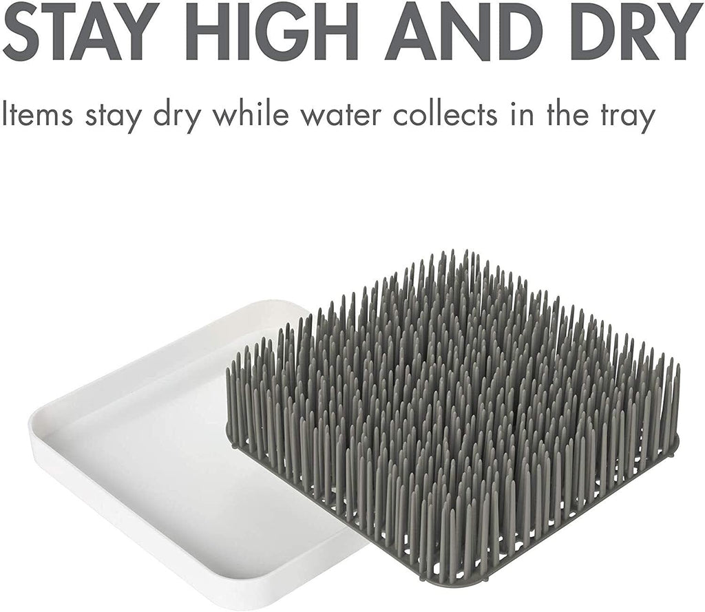 Boon Grass countertop organizer on a kitchen counter